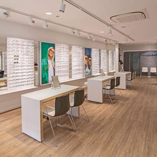 Clean and functional optical shop design for a German optometrist.